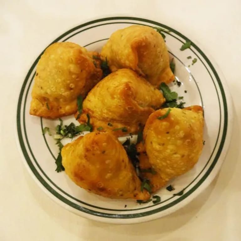 Savor Our Crispy Samosas